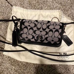 Black and gray coach purse.